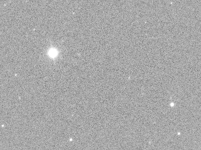 A telescope image with grey background noise and a few bright stars.